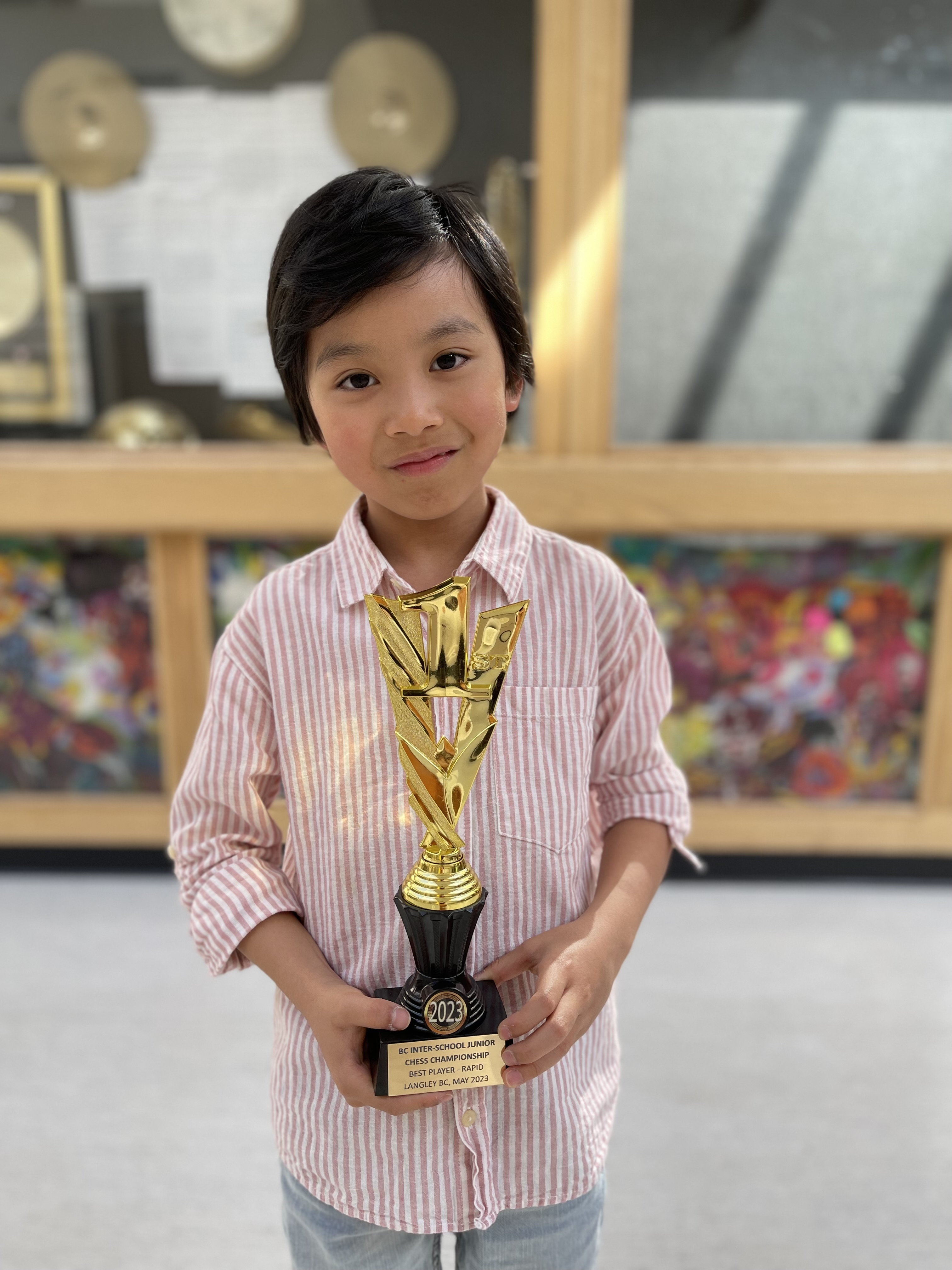 Lucas with medal and trophy