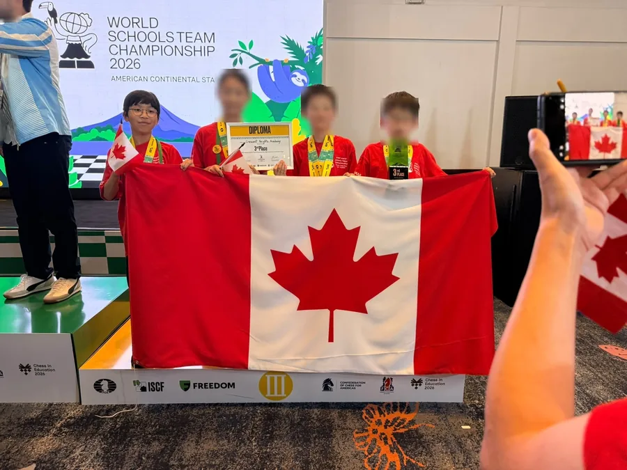 Lucas Yao and his school team on the podium with the Canadian flag in Costa Rica