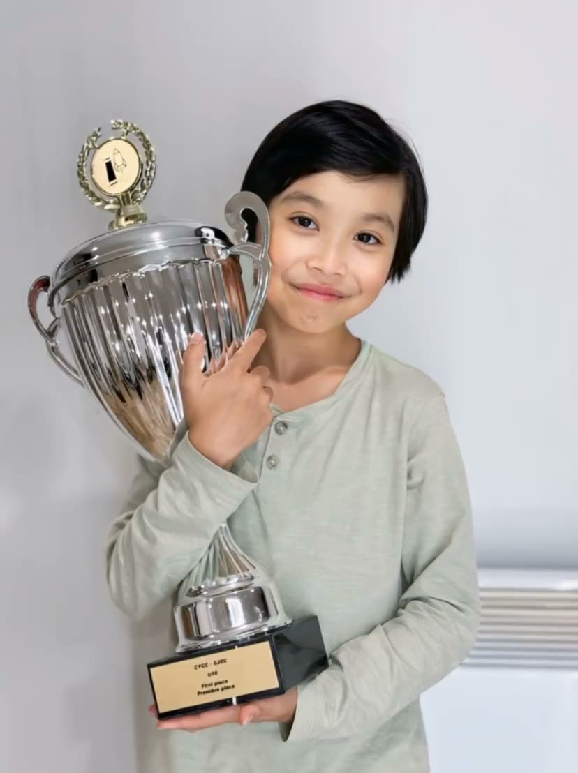 Light sweeping across a first-place silver cup